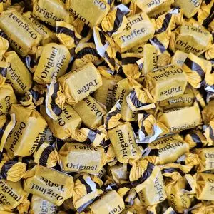 Individually wrapped traditional creamy vanilla flavour chewy toffees in a gold and brown wrapper