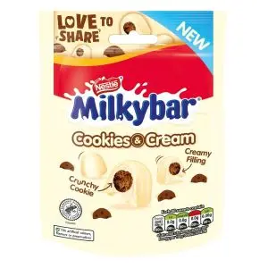 A share size pouch of Milkybar white chocolate sweets with a creamy filling and cookie pieces.