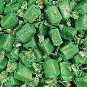 Individually wrapped traditional mint flavour chewy toffees in a green and gold wrapper