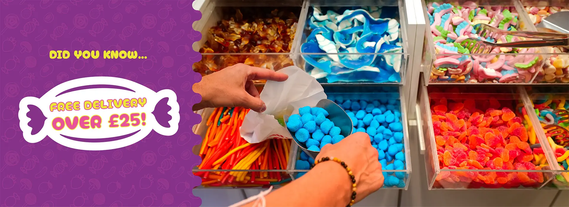 Assorted sweets selection showcasing blue sweets being placed into a paper bag and cola bottle sweets, pencil sweets, fizzy sweets and foam sweets in the background with a banner reading 'Free Delivery Over £25'