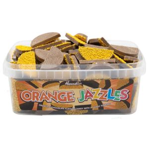 A full tub of retro sweets, orange and chocolate flavour candy with a candy topping