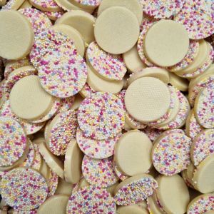 Hannahs mega snowies are white chocolate flavour discs with multicoloured sprinkles on top