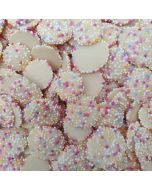 white chocolate buttons with multicoloured sprinkles on top