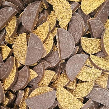 Hannahs mega jazzies are milk chocolate flavour discs with multicoloured sprinkles on top