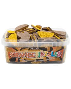 A full tub of retro sweets, orange and chocolate flavour candy with a candy topping