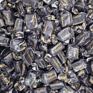 Individually wrapped traditional liquorice flavour chewy toffees in a black and gold wrapper