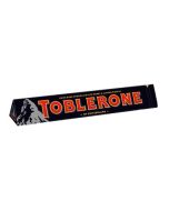 Toblerone Dark Chocolate 100g bar in the shape of swiss mountains with honey and nougat